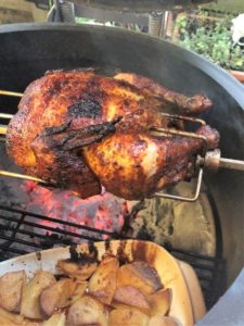 Kamado Joe Joetisserie Chicken with corn and pumpkin.